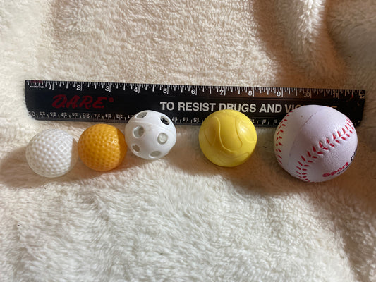 4 plastic balls 1 soft Squish white baseball