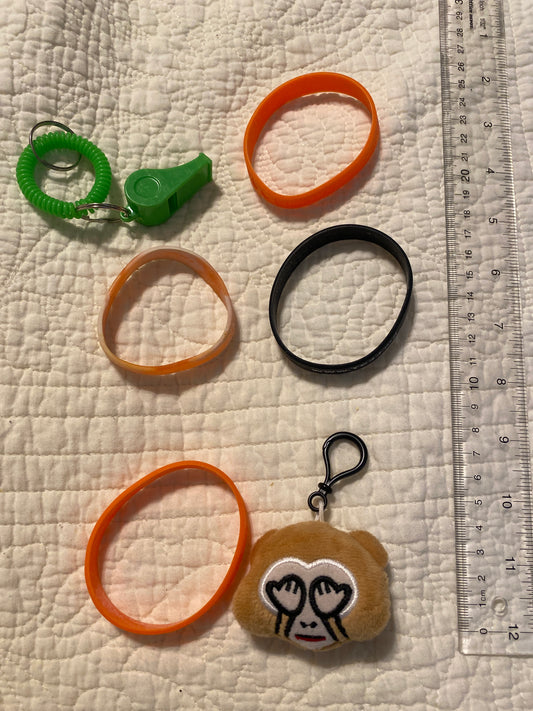 4 rubber bracelets A whistle & backpack
