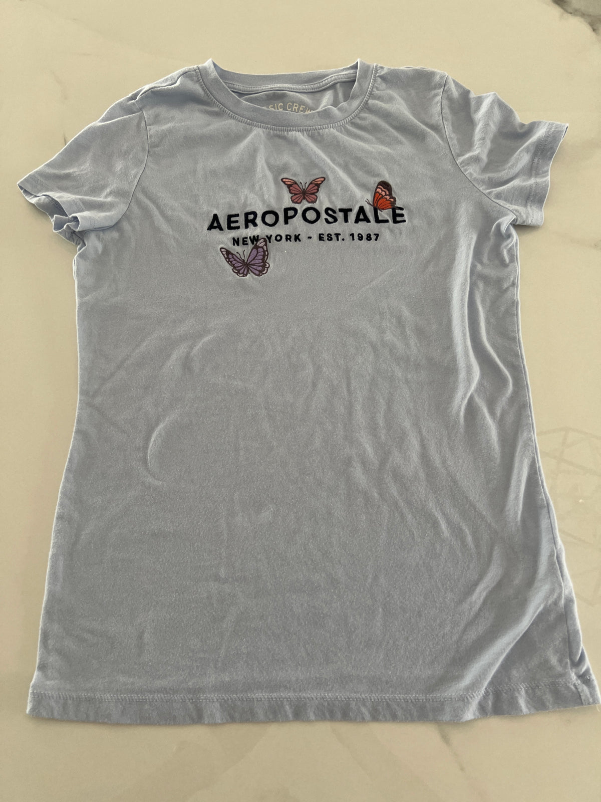 Aeropostale SS top Lt blue w/ butterflies - size Junior - M (7/9)