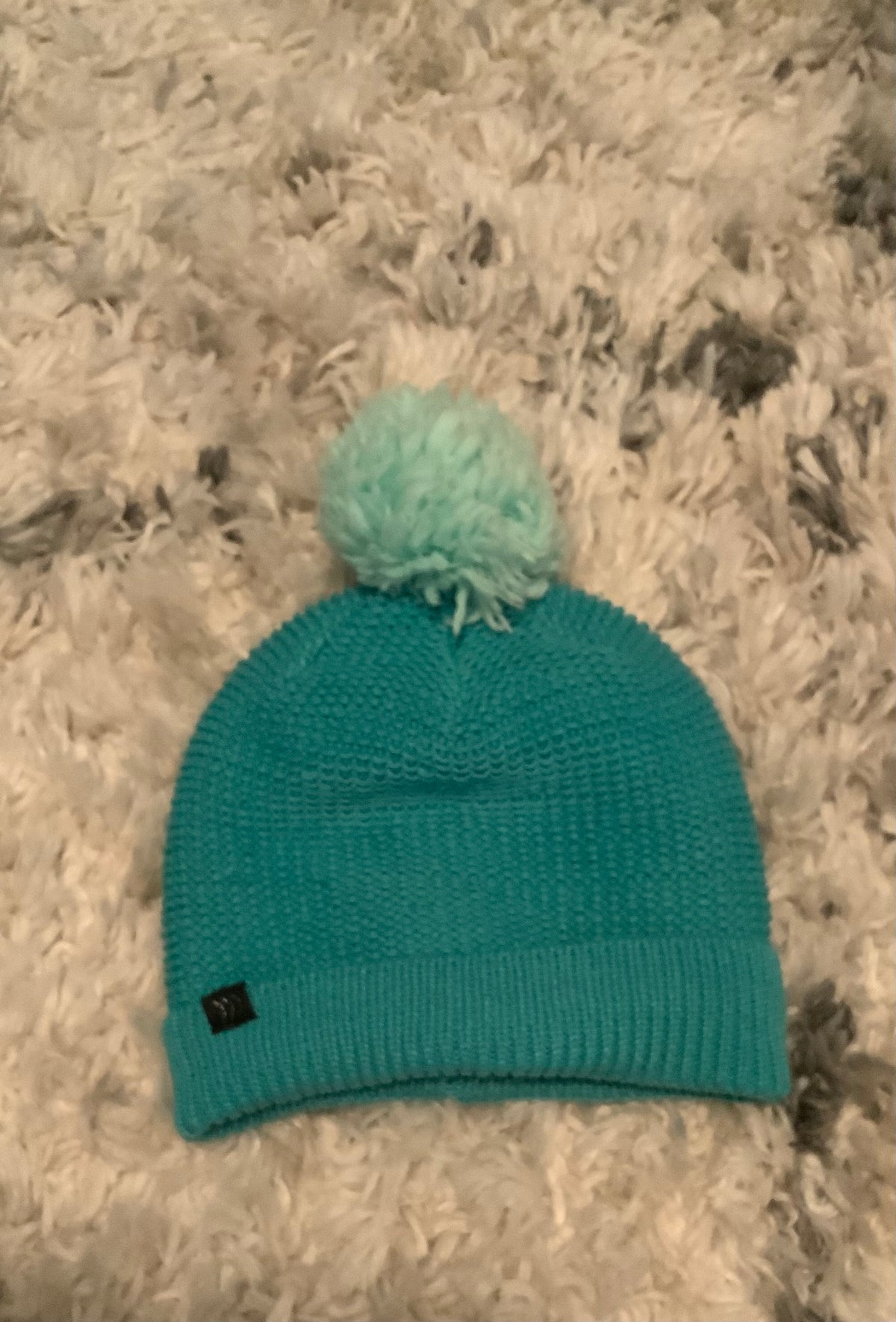 teal ski hat