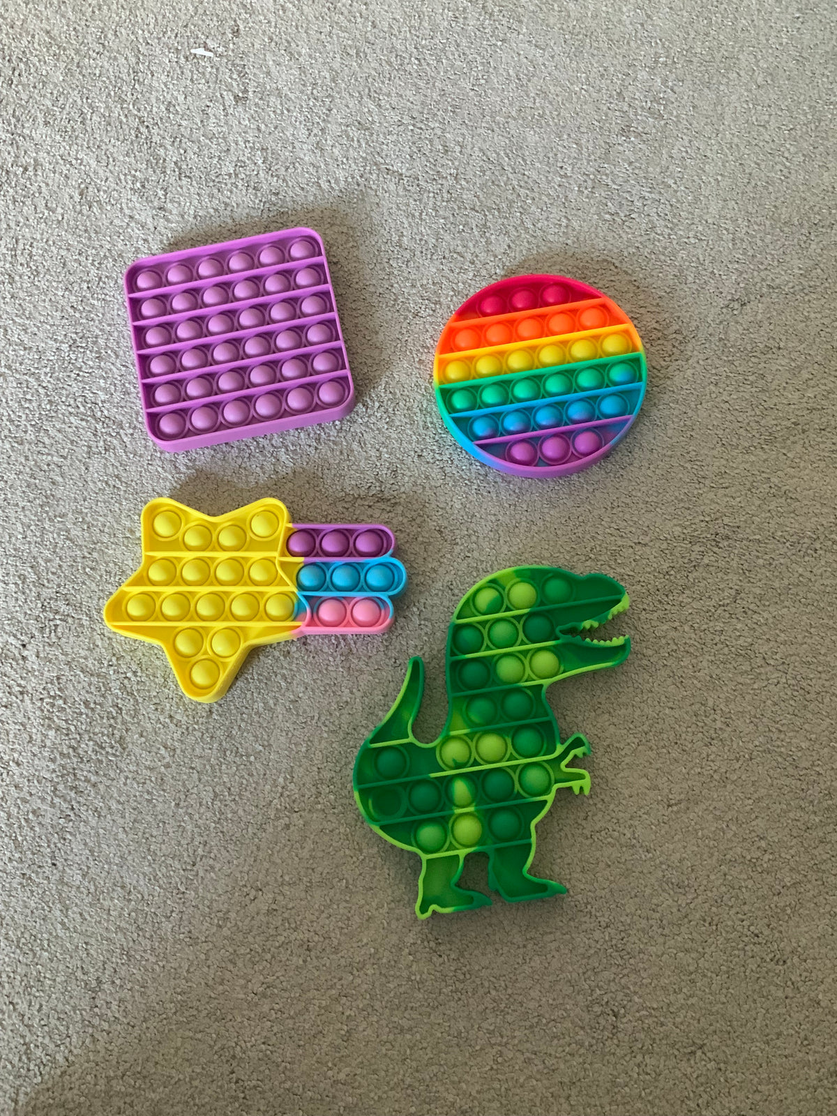 4 pop its star, purple T-Rex, rainbow color