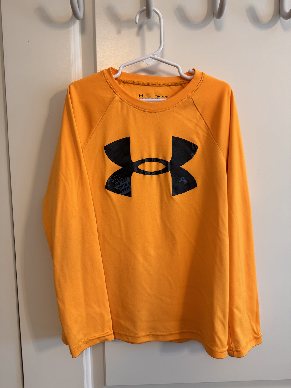 Shirt: UA Lt. Orange Under Armour EUC - size Youth - 7 (S)