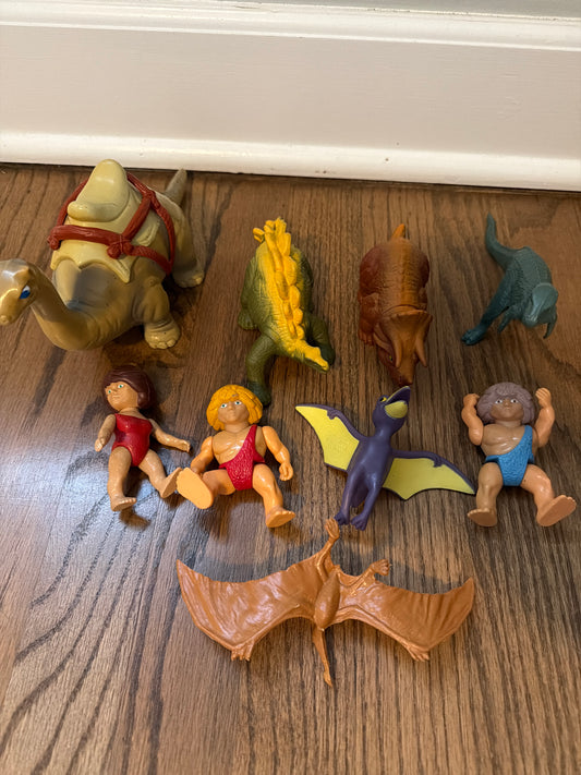 Dinosaur and cave men