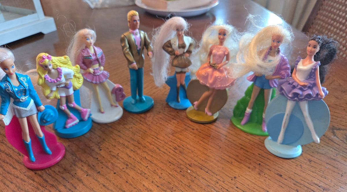 7 Barbies and 1 Ken They are 4-5 inches tall