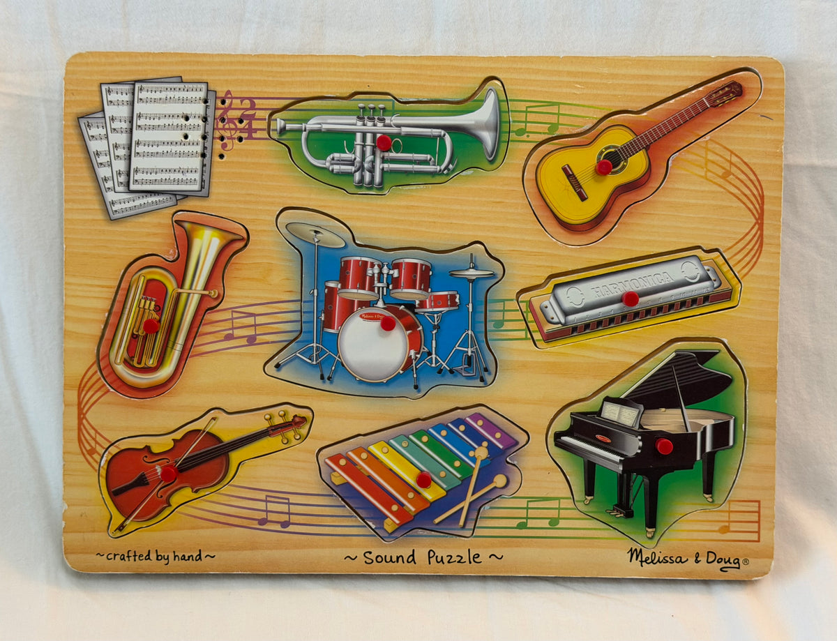 M & D Musical instrument Puzzle, plays sounds.