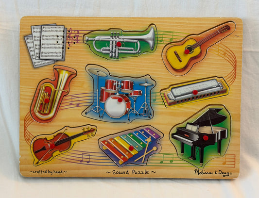 M & D Musical instrument Puzzle, plays sounds.