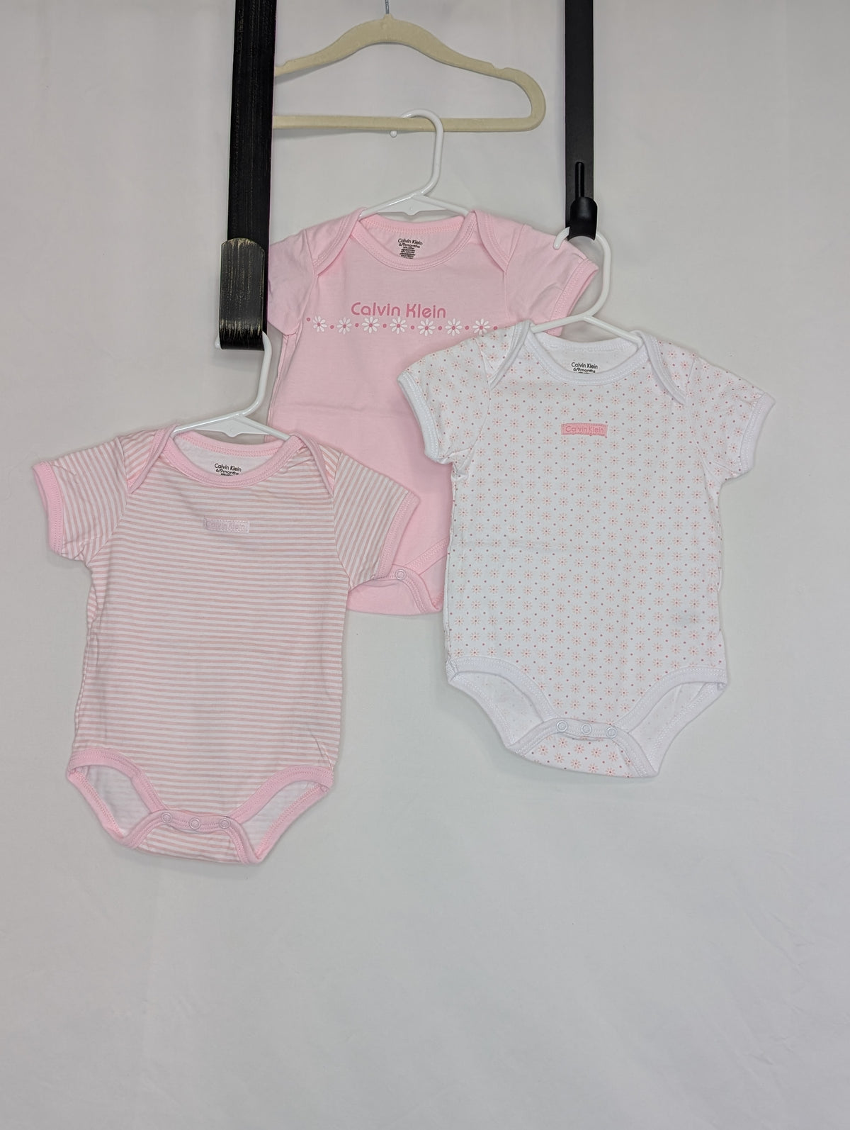 EUC Calvin Klein set 3 onesies, white w/pink - size Month - 6-9 / 9M