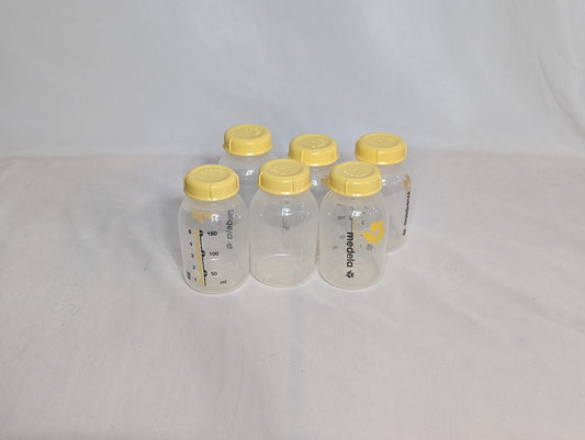 6 Medela bottles, 5 oz Bottles and lid only