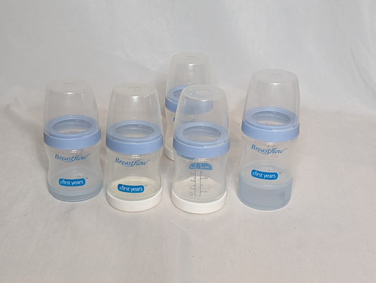5 Breastflow bottles, Caps, rings, lids, & 2