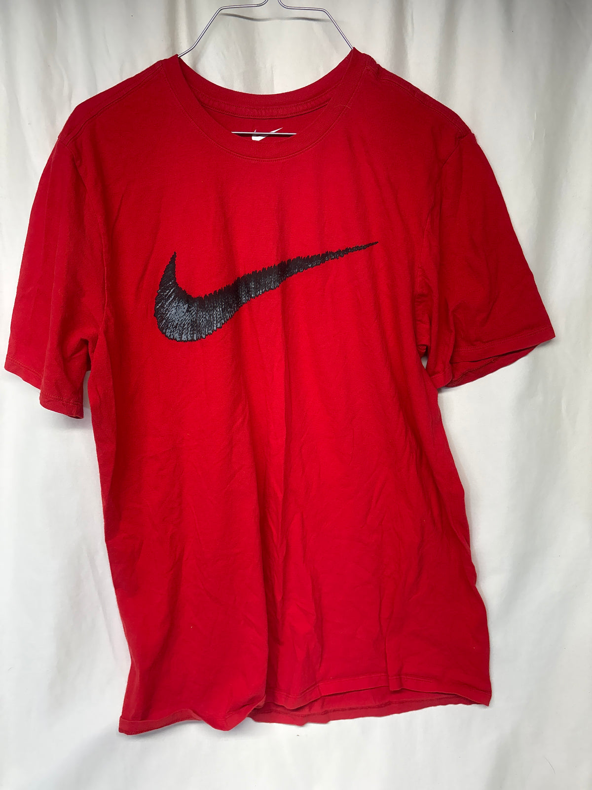 Nike red tee w/ black swoosh - size Teen/Men - L (36-38)