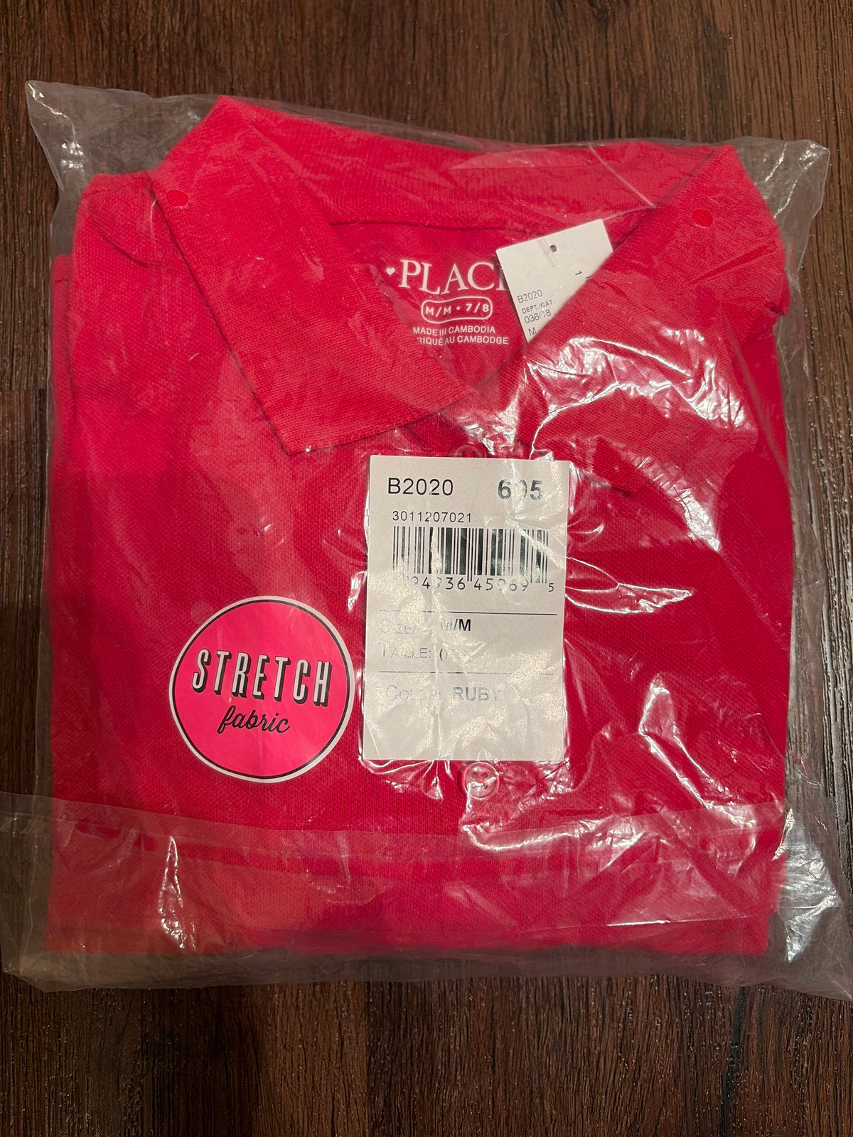 New school uniform. Red polo shirt - size Youth - 7 (S)