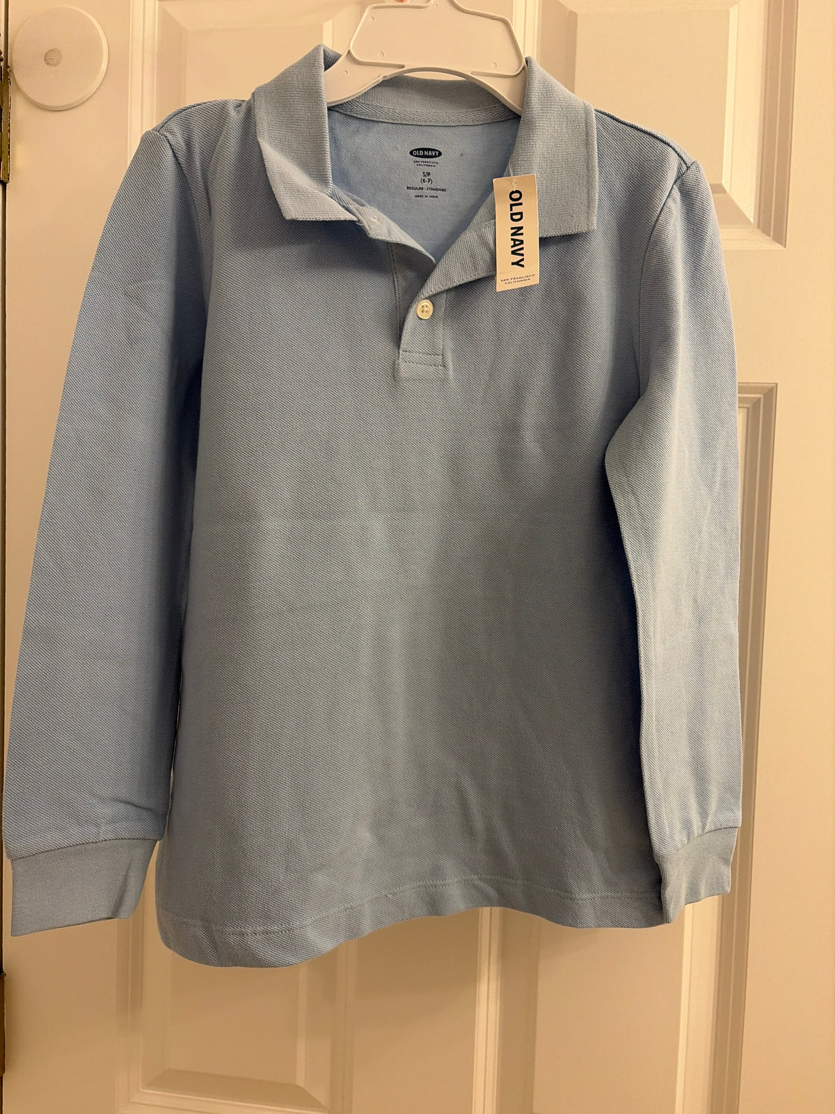 New polo shirt Baby blue. Long sleeve - size Youth - 6 (S)