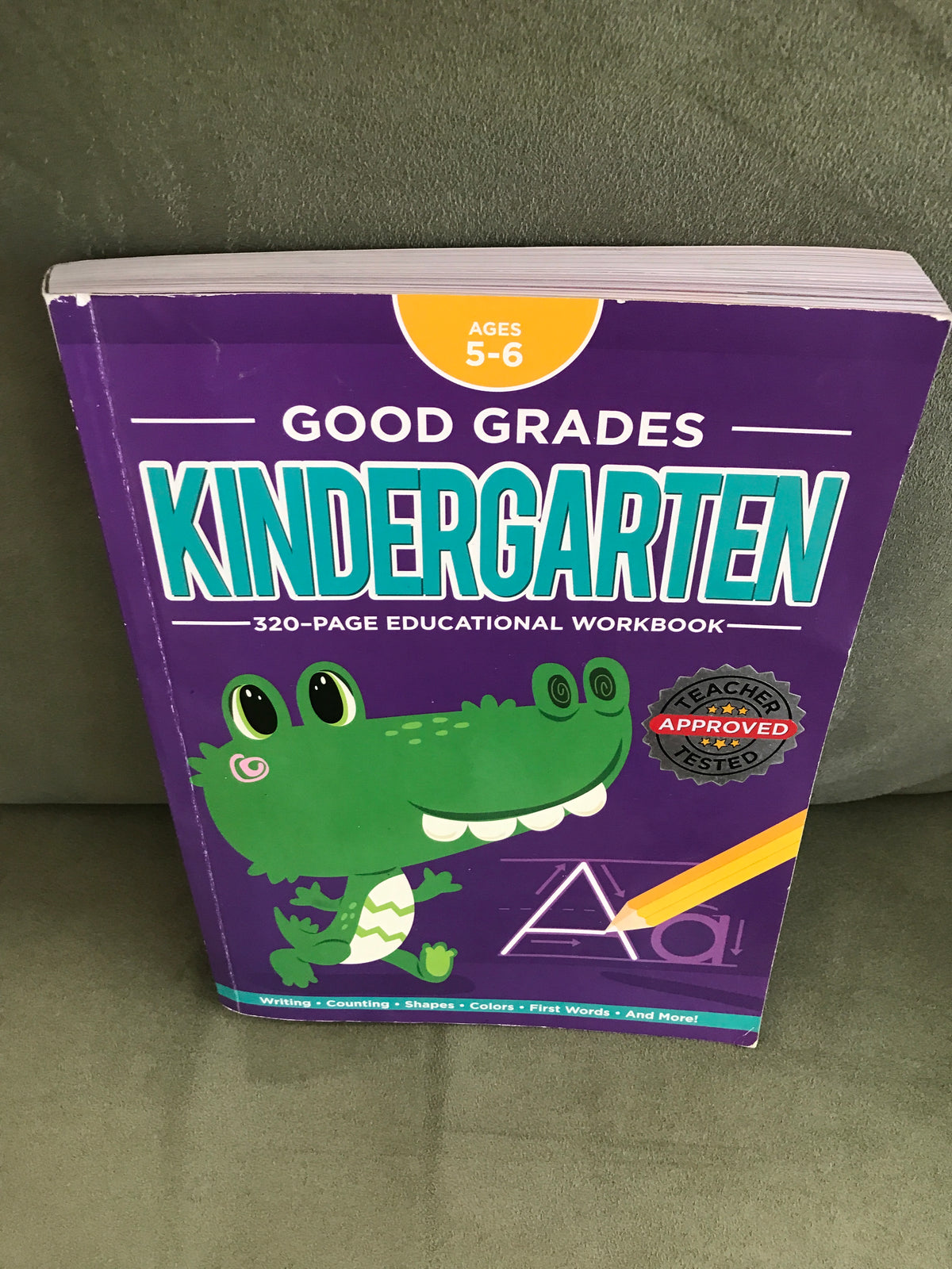 Kindergarten workbook 4+ 1/4 used, 3/4 new
