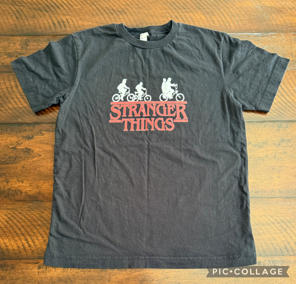 Stranger Things top -black, red print - size Youth - 10 (L)