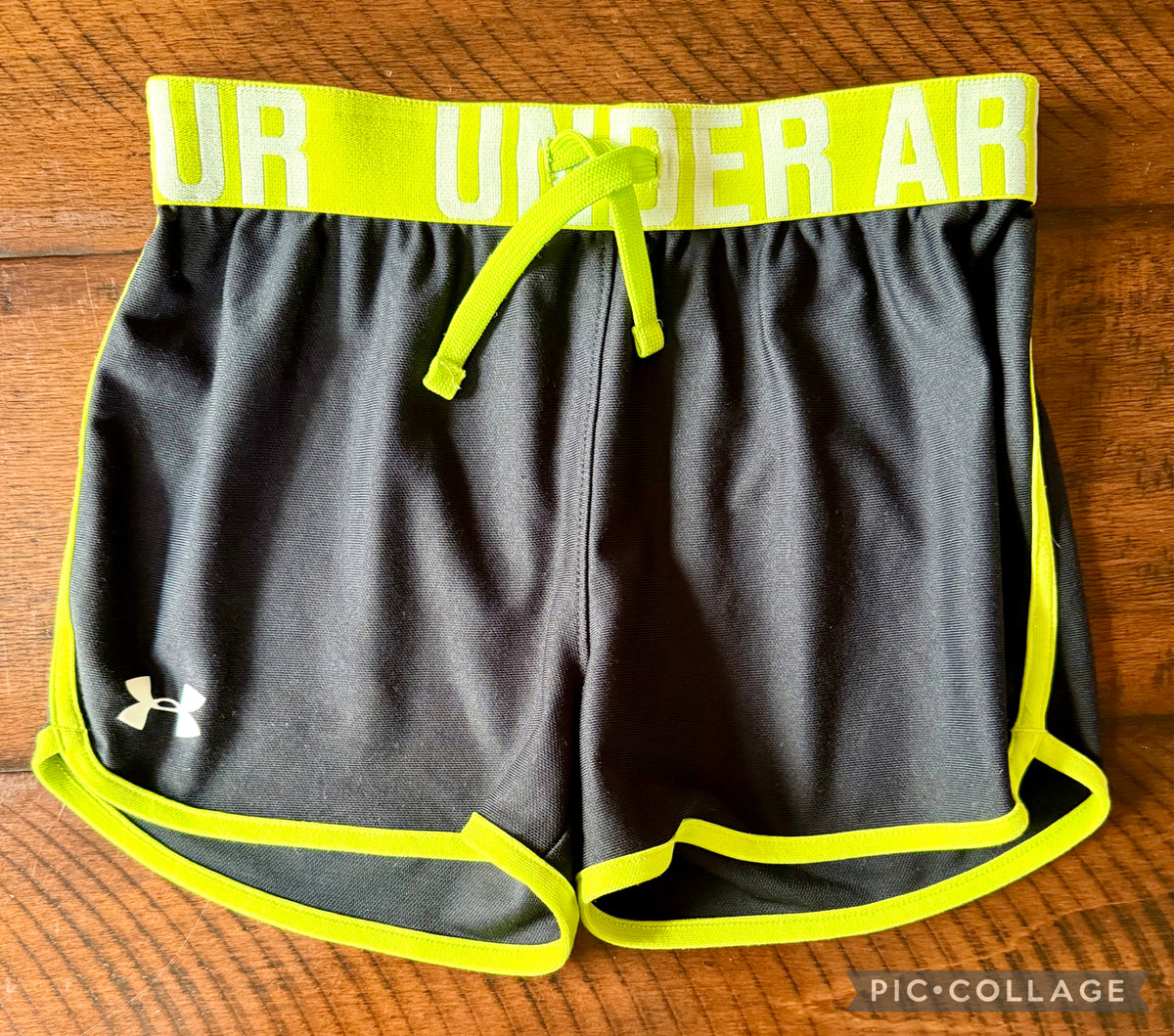 Under Armour shorts -black with lime - size Youth - 8 (M)