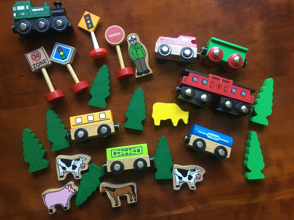 25 wooden trains, trees, signs, animals